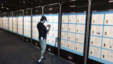 A display of giant iPhones at the Los Angeles County Fair show some of Apple's patents.