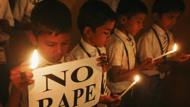 Children take part in a candlelit vigil for a gang rape victim assaulted on a New Delhi bus. The incident in December 2012 triggered global outrage and highlighted the problem of sexual violence in India. 