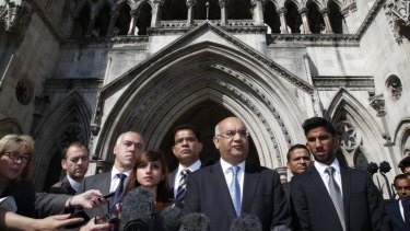 Labour MP Keith Vaz, centre, talks to the media as late nurse Jacintha Saldanha's family look on following an inquest into her death.