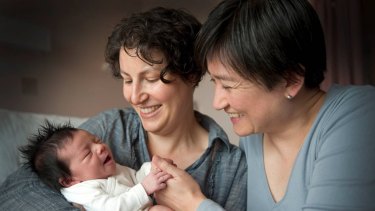 Penny Wong and partner Sophie Allouache after the birth of their daughter Alexandra in 2011. 