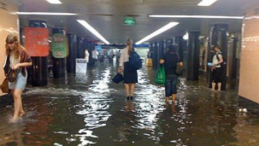 Water floods the Degraves Street Subway in Melbourne this afternoon.