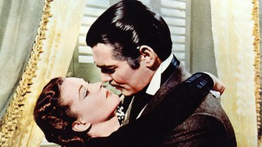Rhett Butler played by Clark Gable and Scarlett O'Hara played by Vivien Leigh in the film of <i>Gone With The Wind</i>.