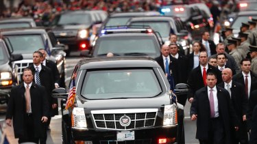 Mr Trump, pictured surrounded by Secret Service agents, said he was still getting used to around-the-clock protection.