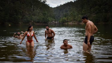 Friends from Liverpool cool off at Bents Basin near Warragamba on Monday.