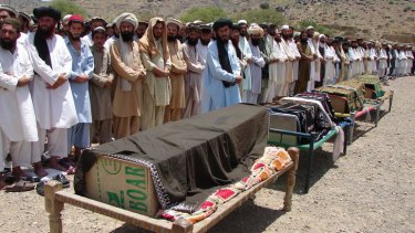 Pakistani villagers offer funeral prayers for people who were reportedly killed by a US drone attack in Miranshah in 2011.