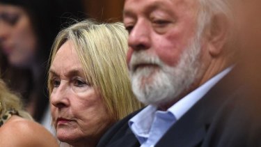 Dignified silence: The parents of victim Reeva Steenkamp, June (left) and Barry listen to the ruling.