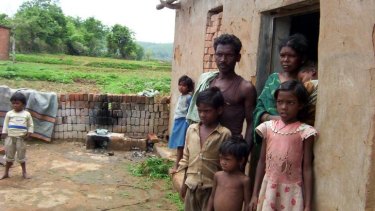 Pusanidevi Manjhi, pictured with husband Gooda and their children, was accused of being a witch by a landowner in Palani, India.