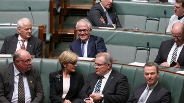Communications Minister Malcolm Turnbull, Foreign Affairs Minister Julie Bishop and Social Services Minister Scott Morrison during a division at Parliament House in Canberra on Monday September 14. 