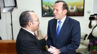 Tony Abbott shakes the hand of his PNG counterpart Peter O'Neill in March.