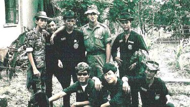 Historian Derrill de Heer in Vietnam with South Vietnamese soldiers in Hoi My village in 1970.