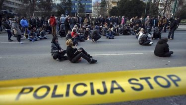 Protesters block traffic in front of a government building in Sarajevo.