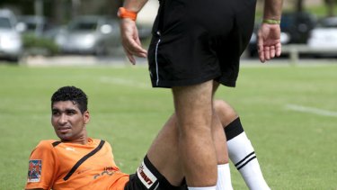 Mohamed Adnan takes a break after Brisbane Roar training.