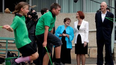 On the hop ... the Prime Minister, Julia Gillard, speaks with the Turner School principal, Jan Day, as the Minister for School Education, Peter Garrett, looks on.