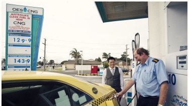 Good value: Tuyen Hua, left, of OES CNG SmartGas, watches as Eastmorr Taxis driver Robert Howard fuels up.