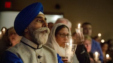 Hundreds of people attend a vigil in Olathe, Kansas, last month in response to the deadly shooting of shooting two Indian immigrants at a bar.