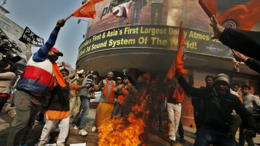 Activists of right-wing organisations Bajrang Dal and Hindu Sena burn the posters of PK, a film starring Aamir Khan in Delhi last year.