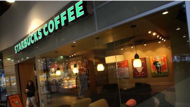 Pouring and scouring ... Starbucks employees have  been serving customers and cleaning toilets.