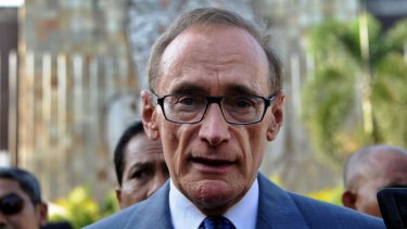 Australian foreign minister Bob Carr speaks to journalists after laying a wreath at a monument for victims of 2002 Bali bombing.