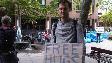 Protester Daniel Jones offering an unusual service at the occupation in Martin Place today.