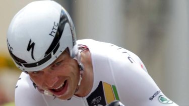 Stage winner ... Germany's Tony Martin reacts as he crosses the finish line in Grenoble. He finished seven seconds ahead of Evans.