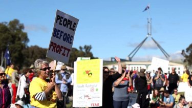 Scenes from March in March rally in front of Parliament House in Canberra.