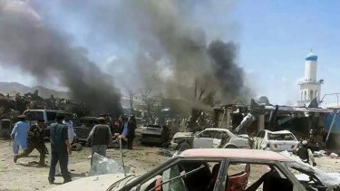 Afghan security personnel rush to the scene of the suicide attack at a market in Urgun district, Paktika province on Tuesday.