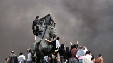 Angry scenes ... protesters gather at the statue of Alexander the Great in Cairo to demand the resignation of Hosni Mubarak