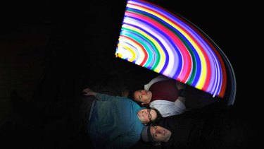 Lightening up: Lindsay Cox (bottom), Alisha and Capo in a spin with their art installation.