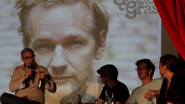 The Chaser's Julian Morrow MCs a forum featuring Julian Assange via video link at Splendour in the Grass.