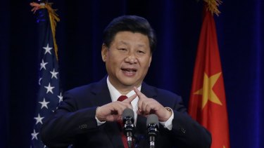 Chinese President Xi Jinping talks about how the Chinese symbol for the word "people" resembles two sticks supporting each other at a banquet in Seattle.  