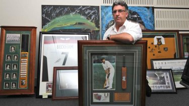 The HSU's Gerard Hayes with some of the sporting memorabilia.