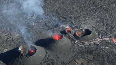 Lava erupts from a crater on the Fournaise range on Reunion island.