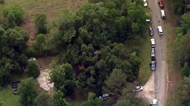Mass grave ... US authorities investigate at a rural Texas house.