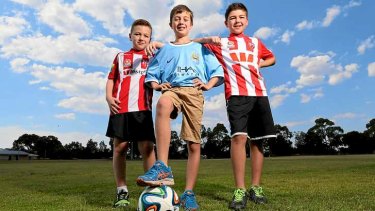 Melbourne Heart fans Oisin, Darcy and Fionn after Manchester City announced it would buy the Heart.