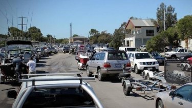 High and dry: Peak times at boat ramps at Carrum can mean queuing for hours. 