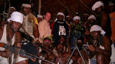Stephen Davis in 2004 with Niger Delta rebels, on the eve of a peace deal with the government. 