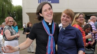 Vicars Kat Campion-Spall (left) and Claire Turner (right) celebrate outside the venue after members voted to approve the creation of female bishops at the Church of England General Synod in York.