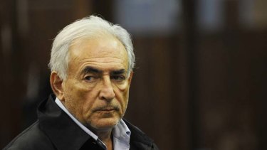 Behind bars accused of rape...Dominique Strauss-Kahn, unshaven and dishevelled, faces Manhattan Criminal Court after being subjected to media humiliation.