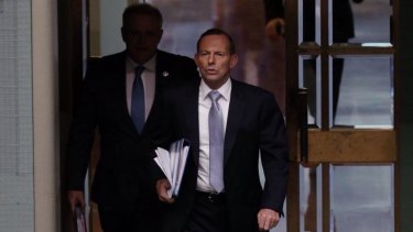 Prime Minister Tony Abbott enters Parliament for question time on Tuesday.
