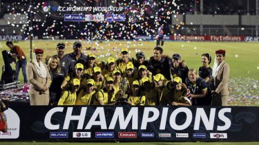 Australian team members celebrate with the trophy after winning the ICC Women's cricket World Cup in Mumbai, India.
