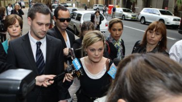 Kristy Fraser-Kirk negotiates a media scrum outside the NSW Supreme Court in August.