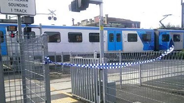 Access to the train is blocked by police tape at Bentleigh station.