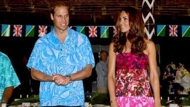 Britain's Prince William, left, and his wife Kate prepare to sit for a meal at Government House in Honiara, Solomon Islands overnight.