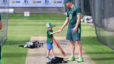Golden summer: Haddin shares a special moment with son Zac before the Boxing Day Test.