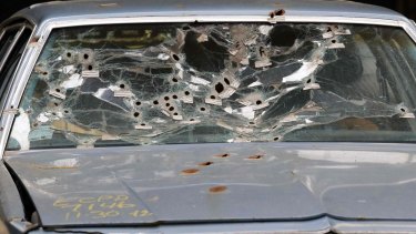 The windshield of Timothy Russell's car is shown in court during the manslaughter trial for police officer Michael Brelo in Cleveland.
