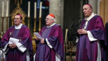 Archbishop Andre-Joseph Leonard (R) and Cardinal Godfried Danneels (C) attend a mass in celebration of "One Year Pope Francis" in Brussels. Belgium Catholics hierarchy is investigating the glowing statue of Mary.