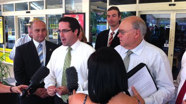 Aidan McLindon (centre) announces the Australian Party's candidate for Ashgrove, Norman Wicks, right.