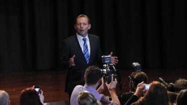 Tony Abbott left the stage at the Rooty Hill RSL last night, while Prime Minister Julia Gillard remained rooted to her stool. <i>Picture: Glen McCurtayne</i>