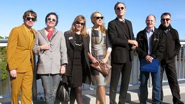 Members of the Go-Betweens join with Lord Mayor Campbell Newman (second from right) to celebrate the impending opening of the Go Between Bridge.