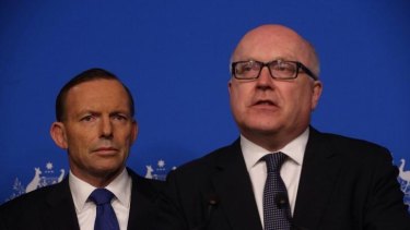 Attorney-General Senator George Brandis (right) with Prime Minister Tony Abbott. Senator Brandis says security will increase at public events if the terror threat is raised,